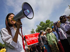 Factory workers demonstrate in favour of minimum wage rate of Kyat 4,000 which is Kyat 400 higher than the proposed rate of Kyat 3,600 