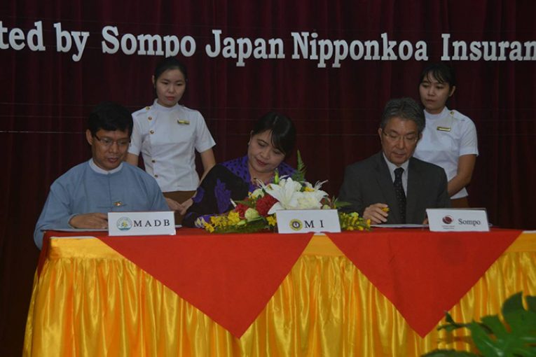 Myanmar Agriculture Development Bank, Myanmar Insurance and Sompo Japan Nipponkoa Insurance Inc signed an agreement to conduct trials for weather index-based crop insurance scheme in Myanmar to protect farmers from losses due to adverse weather  